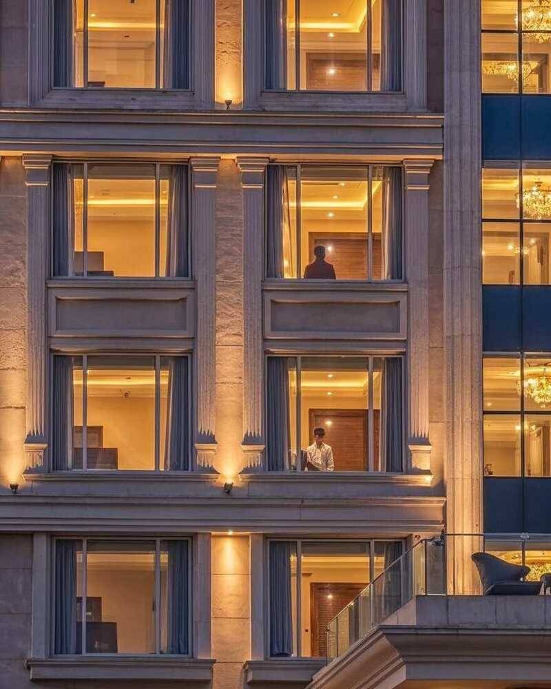 Fluted pilasters lit from the base