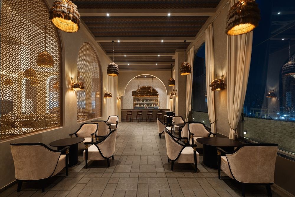 Bar and lounge behind jaali-screened arches