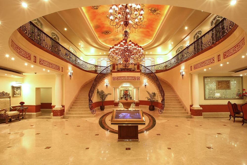 Dual staircases and chandelier in the entrance hall