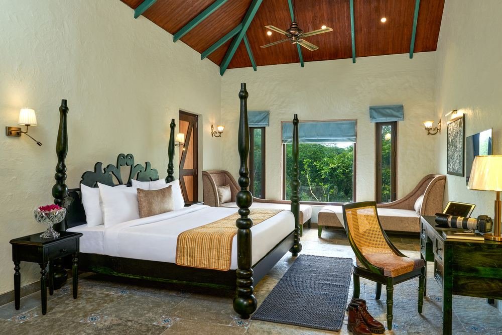 Guest room with four-poster bed and forest outlook