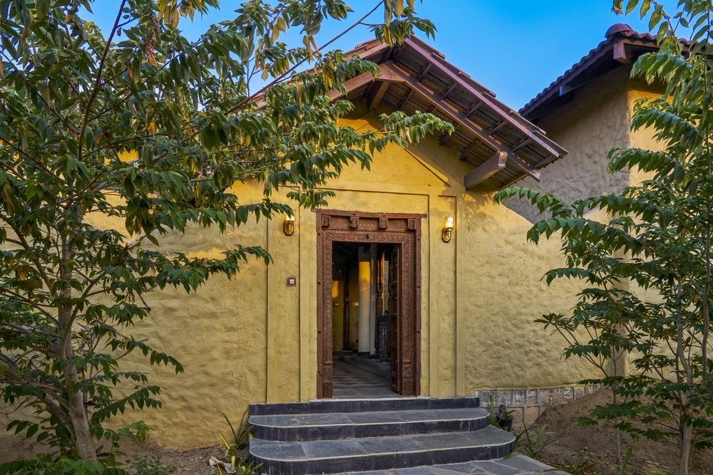 Cottage entrance in local stone and lime plaster
