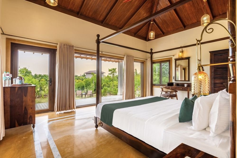 Guest room under a double-height wooden ceiling