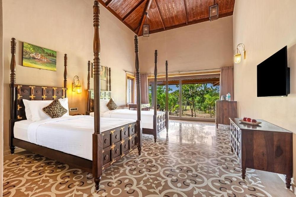 Four-poster bed on patterned terracotta tile